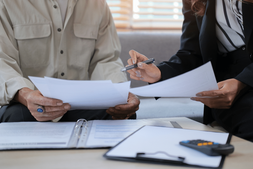 Two people reviewing documents